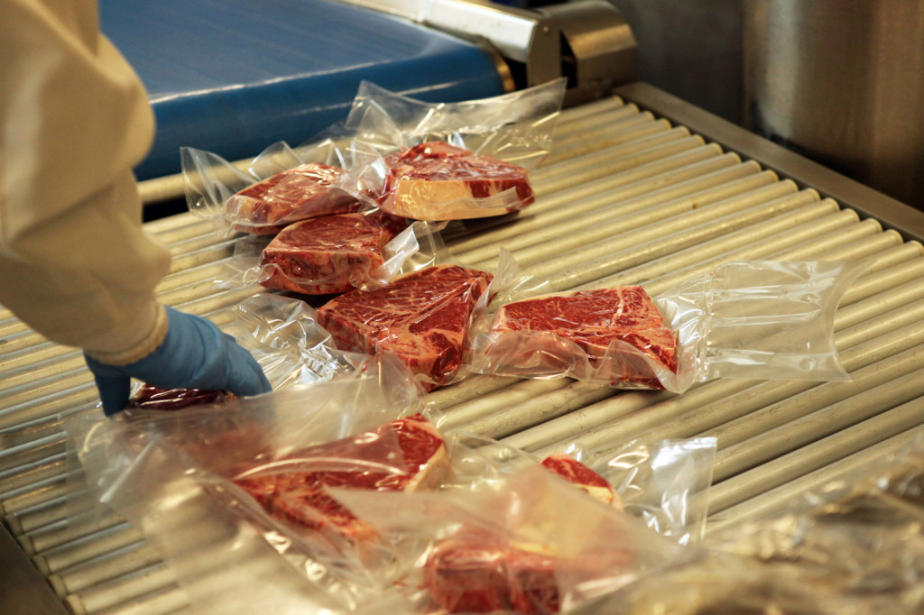 Porterhouses coming off the vacuum sealer